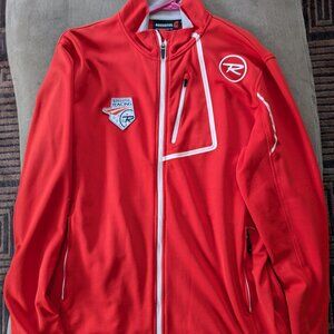 This is a pre-owned Rossignol Ski Racing World Cup men's jacket red in color.